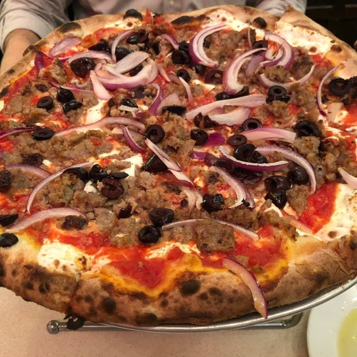 Legendary Coal Oven Pizza Establishments Manhattan Maintain Their Timeless Charm